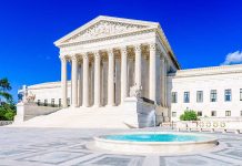 Supreme Court building with fountain under clear sky