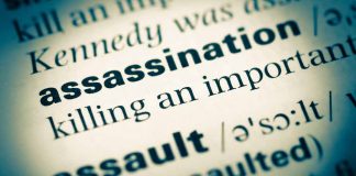 Assassination written on paper