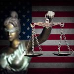 Blindfolded Lady Justice in front of American flag