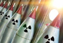 Line of nuclear missiles with radiation hazard signs