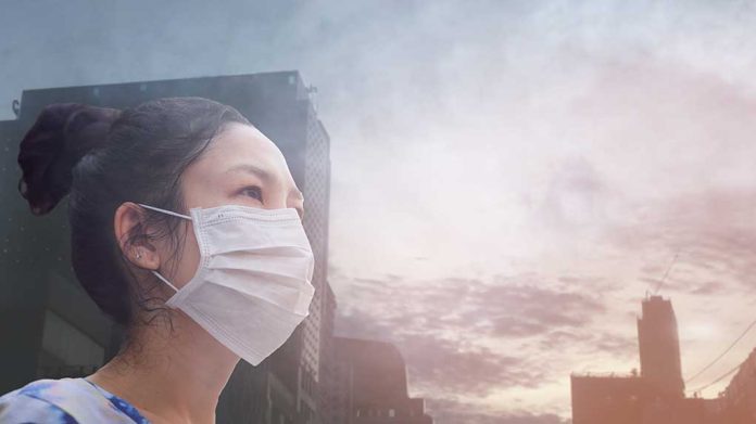 1300560961 featured image Person wearing a mask in a cityscape background