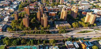 Aerial view of urban area with tall buildings and freeway