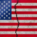 American flag with a large crack through it