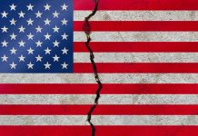 American flag with a large crack through it