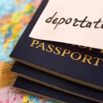 Passports stacked with deportation note on top