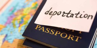 Passports stacked with deportation note on top