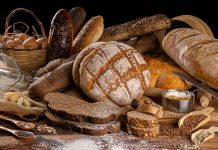 Assorted breads with seeds and baking ingredients