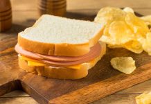 Ham and cheese sandwich with potato chips