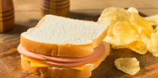 Ham and cheese sandwich with potato chips