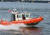 Coast Guard boat speeding on the water