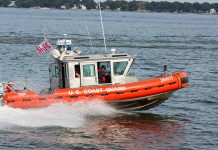 Coast Guard boat speeding on the water