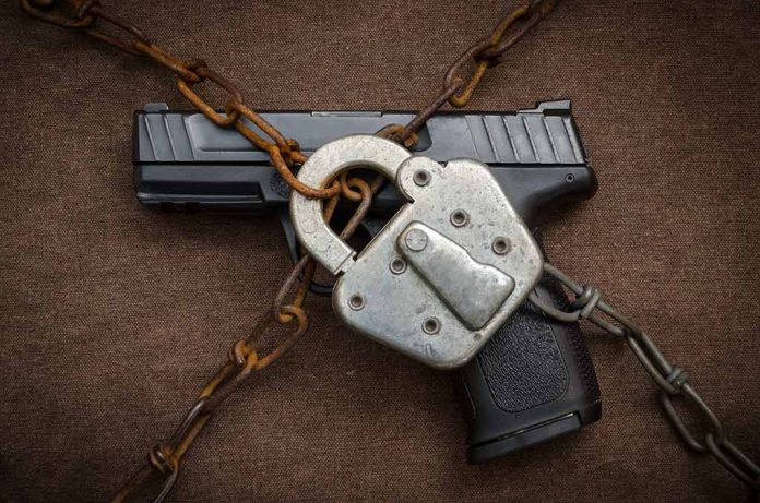 339173702 featured image Handgun secured with chains and a padlock