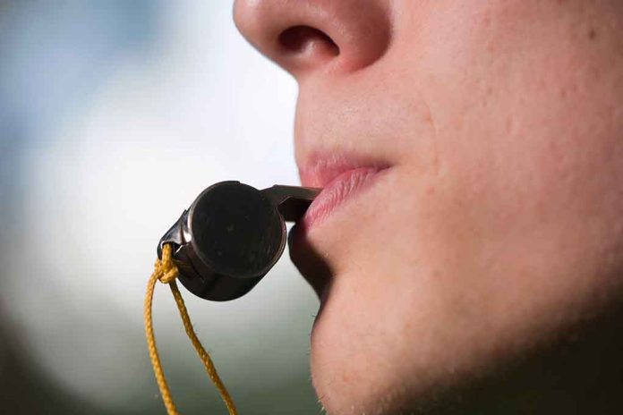409401709 featured image Person holding a whistle in their mouth