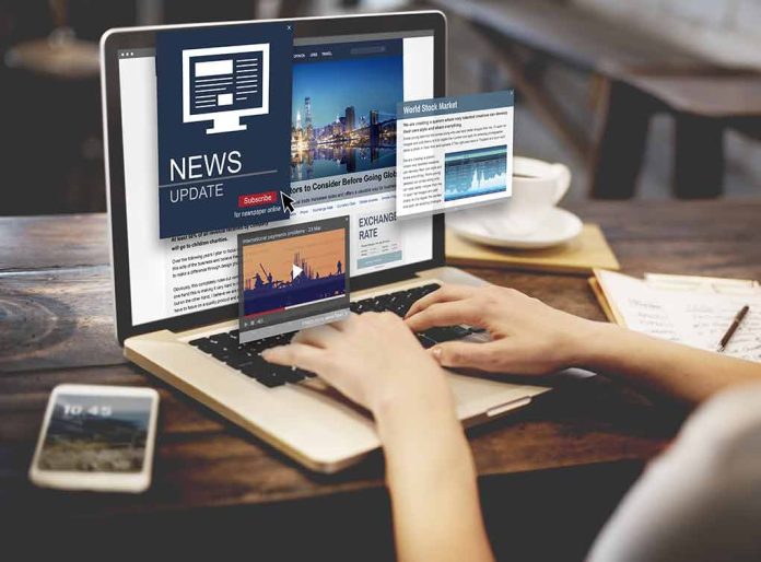 44581384 featured image Person reading news websites on a laptop