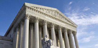 Supreme Court building with statue and columns