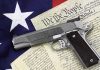 Gun on US Constitution and flag