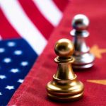 Chess pawns on USA and China flags