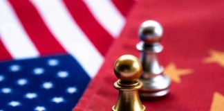 Chess pawns on USA and China flags