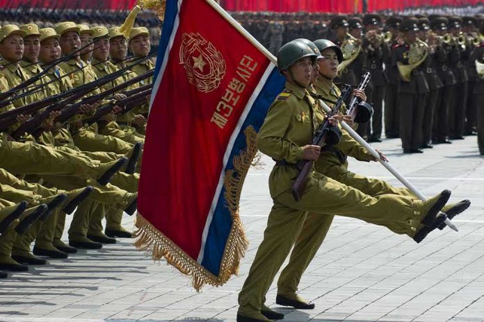 148621262 Soldiers marching with rifles and a red flag