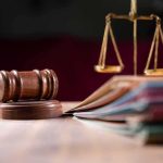 Judges gavel scales of justice and legal documents