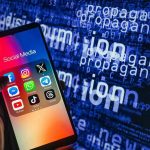 Smartphone showing social media apps with text background