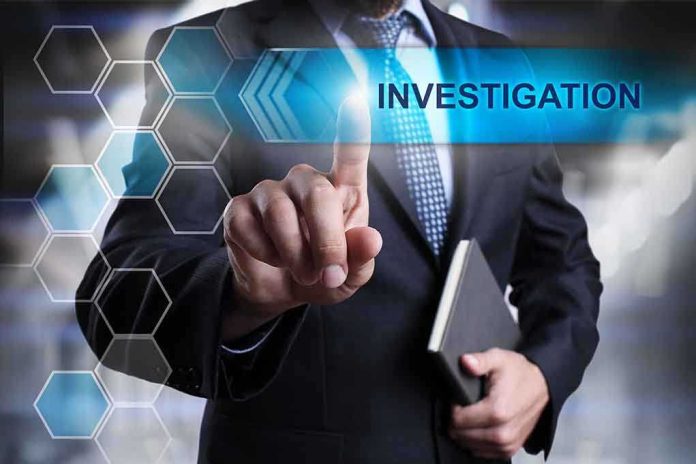 Man in suit pointing at Investigations text