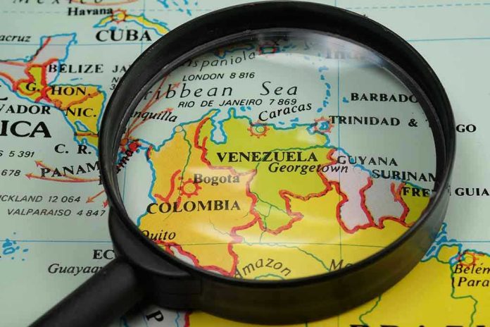 435064315 Magnifying glass focusing on Venezuela and Colombia on map