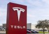 Tesla sign in front of dealership