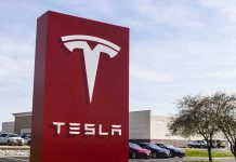 Tesla sign in front of dealership