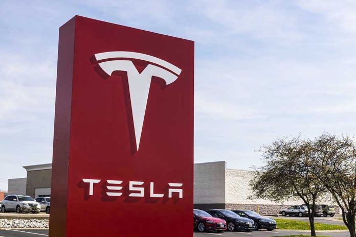 Tesla sign in front of dealership