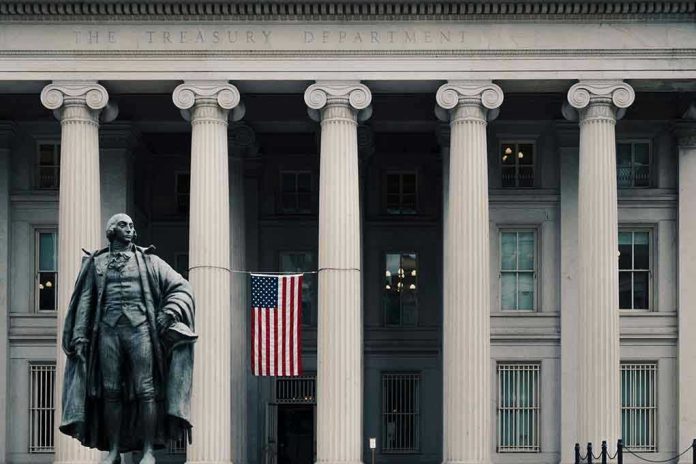 1240657660 US Treasury Department building with statue and flag.