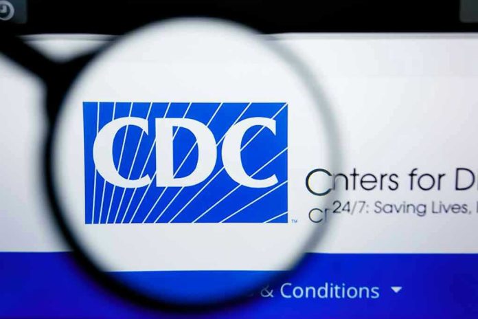 1450445633 CDC logo magnified on a screen