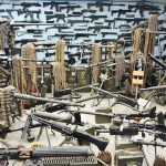 Room filled with various firearms and ammunition belts