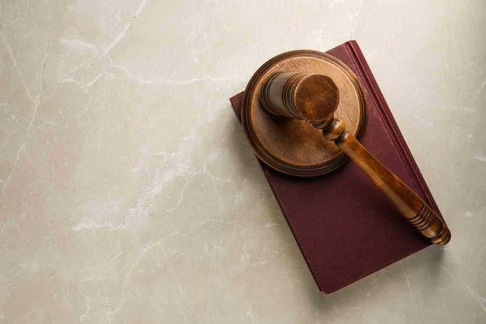Gavel resting on a closed book.