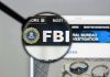 FBI website shown through magnifying glass.
