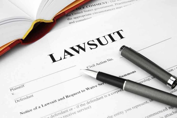Legal document titled Lawsuit with pen and book.
