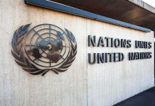 Facade of the United Nations building featuring the UN emblem and text