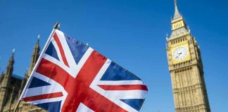 Royal Heckling Erupts – King Charles Ambushed! Union Jack flag with Big Ben in background.