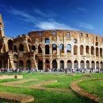 The Colosseum in Rome with tourists walking around it
