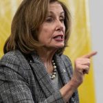 Pelosi UNLEASHES—“Vile Creature” Tirade Hits Trump Woman speaking and pointing, wearing a plaid jacket.