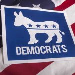 Democrat Civil War Erupts—Party Elders Cornered Democrats logo on American flag background