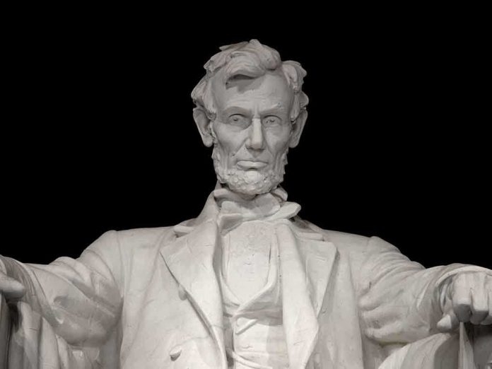 Marble statue of Abraham Lincoln seated with a serious expression