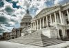The U.S. Capitol building with a cloudy sky backdrop