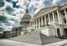 The U.S. Capitol building with a cloudy sky backdrop