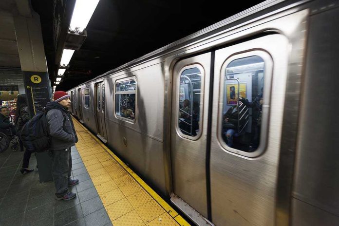 shutterstock_134560958.jpg A commuter waiting at a subway station as a train approaches