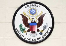 Embassy WARNS Americans – Travel Notice ISSUED! Seal of the United States Embassy featuring an eagle and the American flag