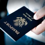 SCOTUS Shocker: Passport RULES Upended Overnight A person holding a United States passport with a dark background