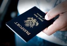 SCOTUS Shocker: Passport RULES Upended Overnight A person holding a United States passport with a dark background