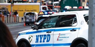 Mamdani ISSUES First Official Project – EXPLOSIVE Collision Coming NYPD police car on a city street scene.