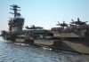 U.S Carrier Deck Turns Into Slippery Death Trap Aircraft carrier deck with jet planes.